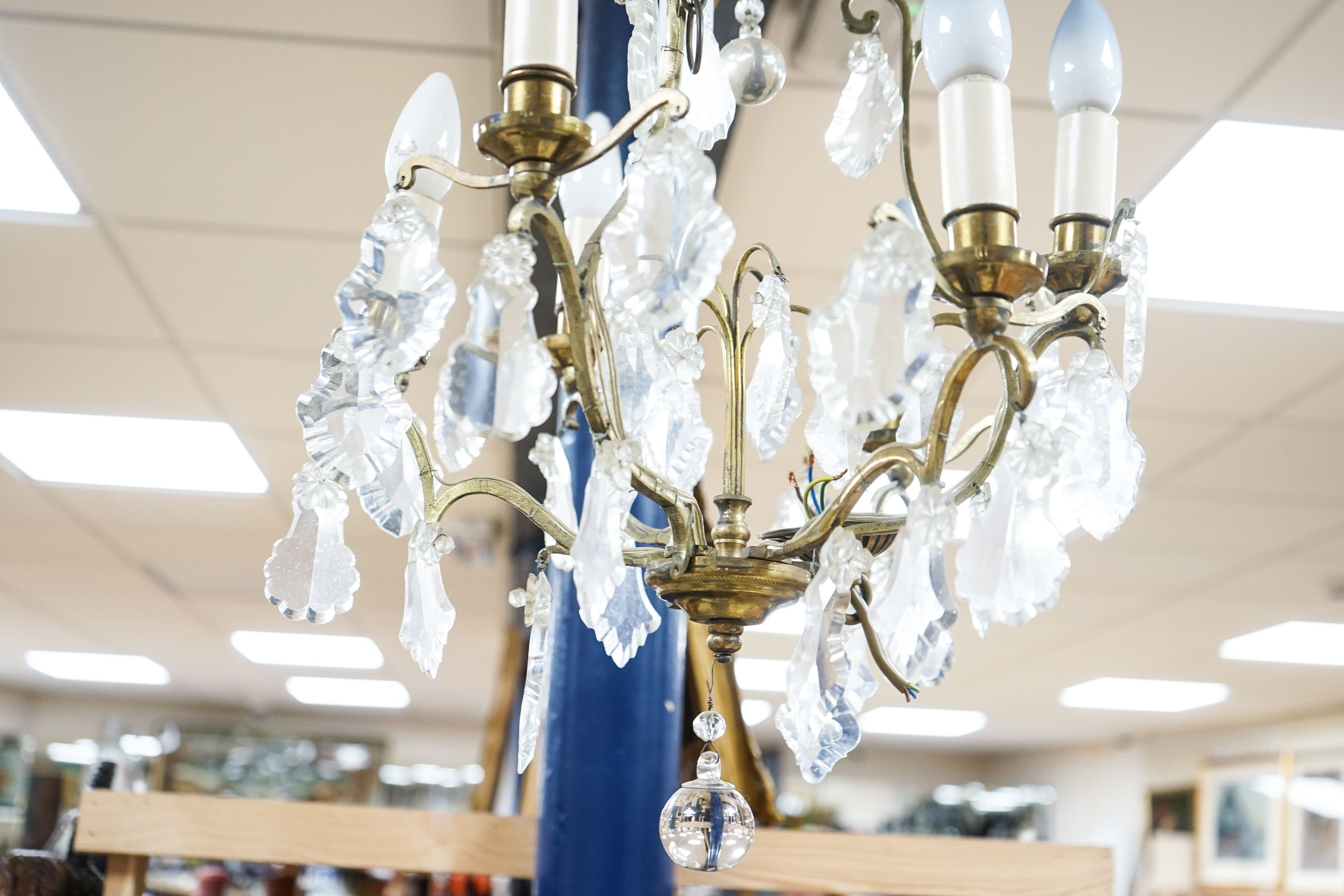 A six branch brass and glass lustre hung chandelier, height 60cm